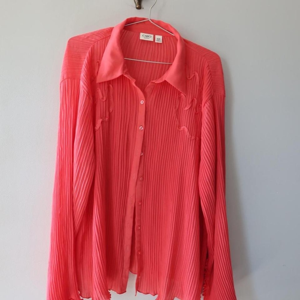 Coral pleated long sleeve button up blouse with ruffles on‎ the hem